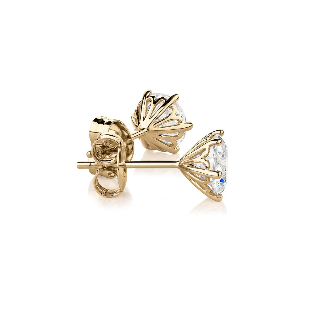 Round Brilliant stud earrings with 2 carats* of diamond simulants in 10 carat yellow gold